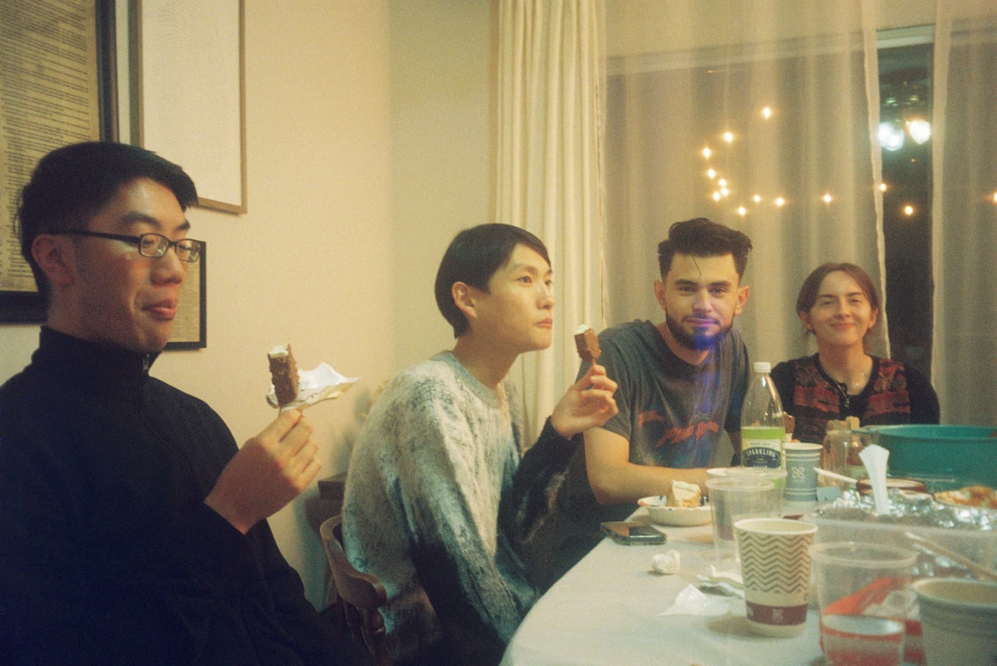 A small group of students sharing life together around a table